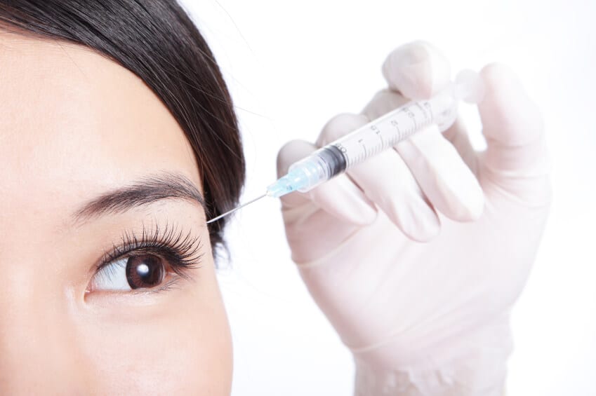 Woman's eyes being injected with Botox