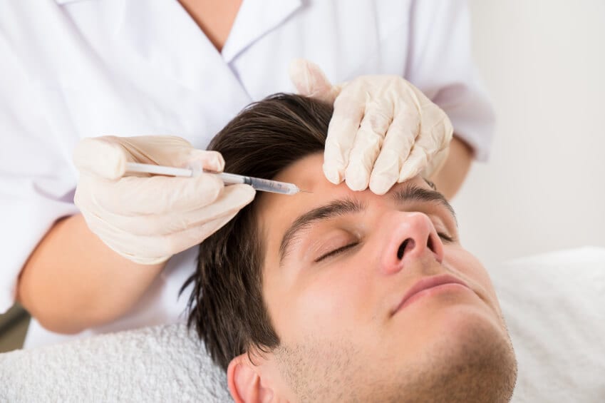 Male patient being injected with Botox