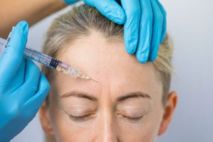 woman getting botox in her forehead in los angeles