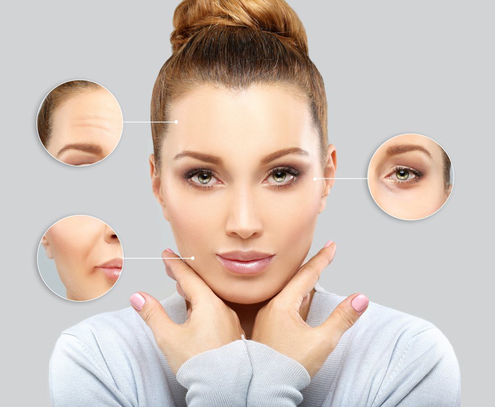 A woman holding her face freshly after Botox. Botox concept, focusing on forehead, jawline and eyes.