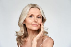 Beautiful gorgeous mid aged mature woman looking at camera after botox