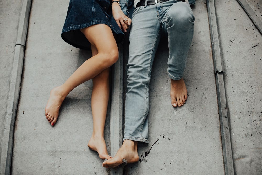 Couple laying down on floor